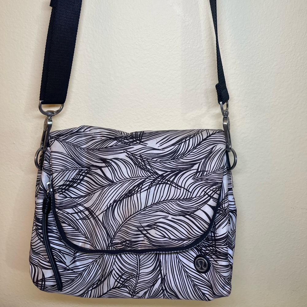 LULULEMON cross body black and white palm print bag.